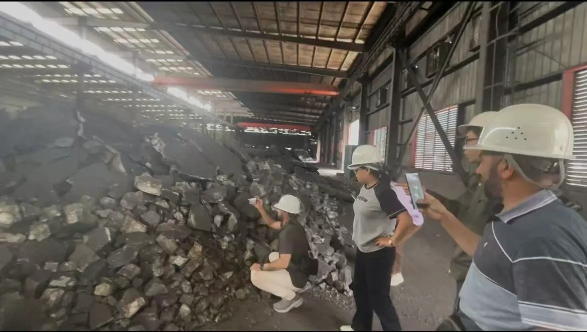 Afghan clients inspecting silicomanganese stockpiles at the Panson production base