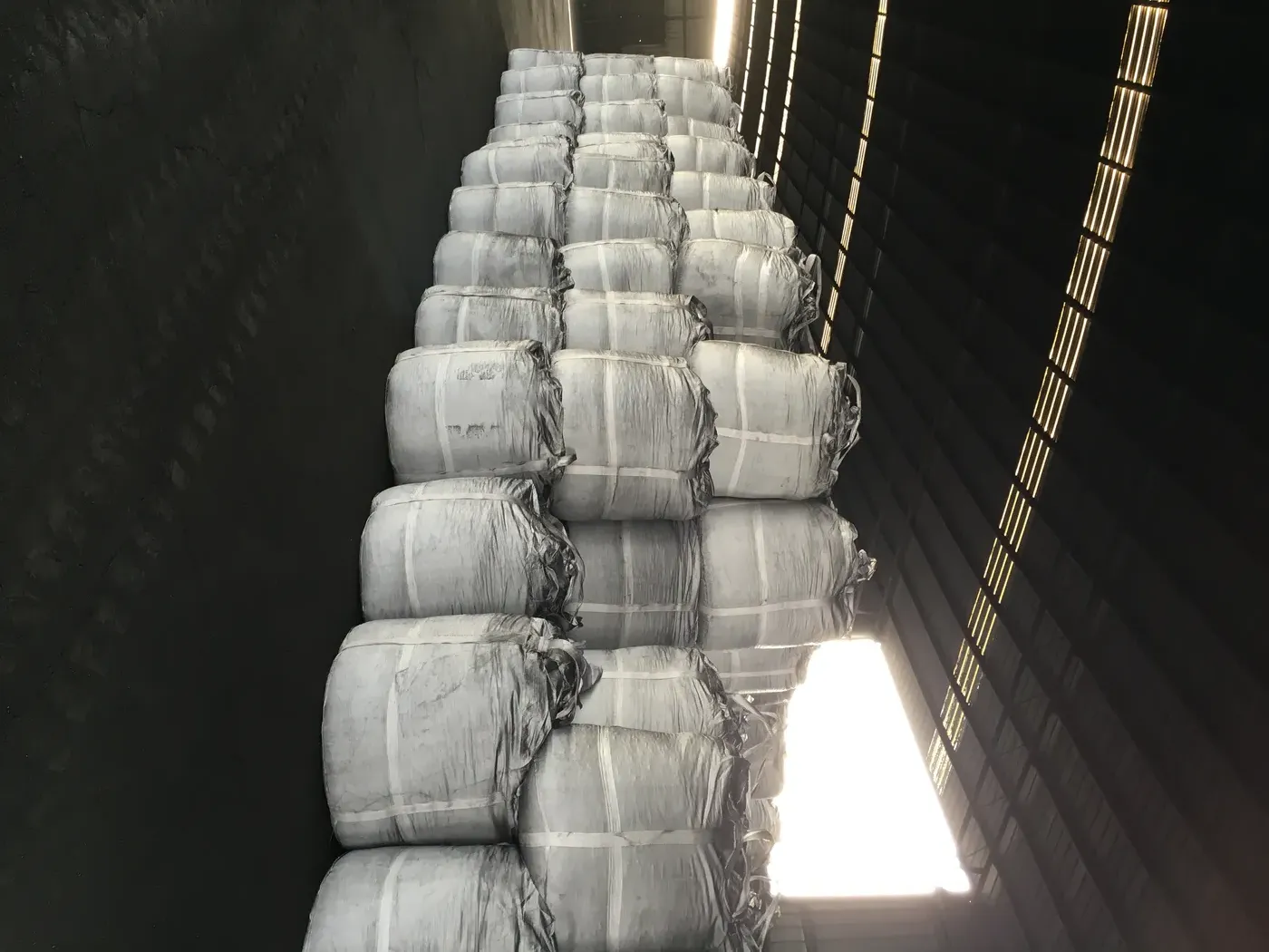 Forklift handling jumbo bags for container loading